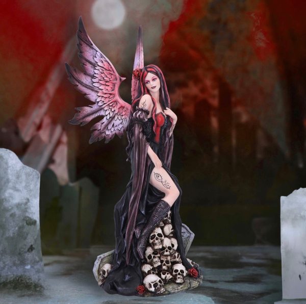 Nemesis Now© “Rose” Gothic Lady With Rose Sitting On Rocks Buried with Skulls(39cm)