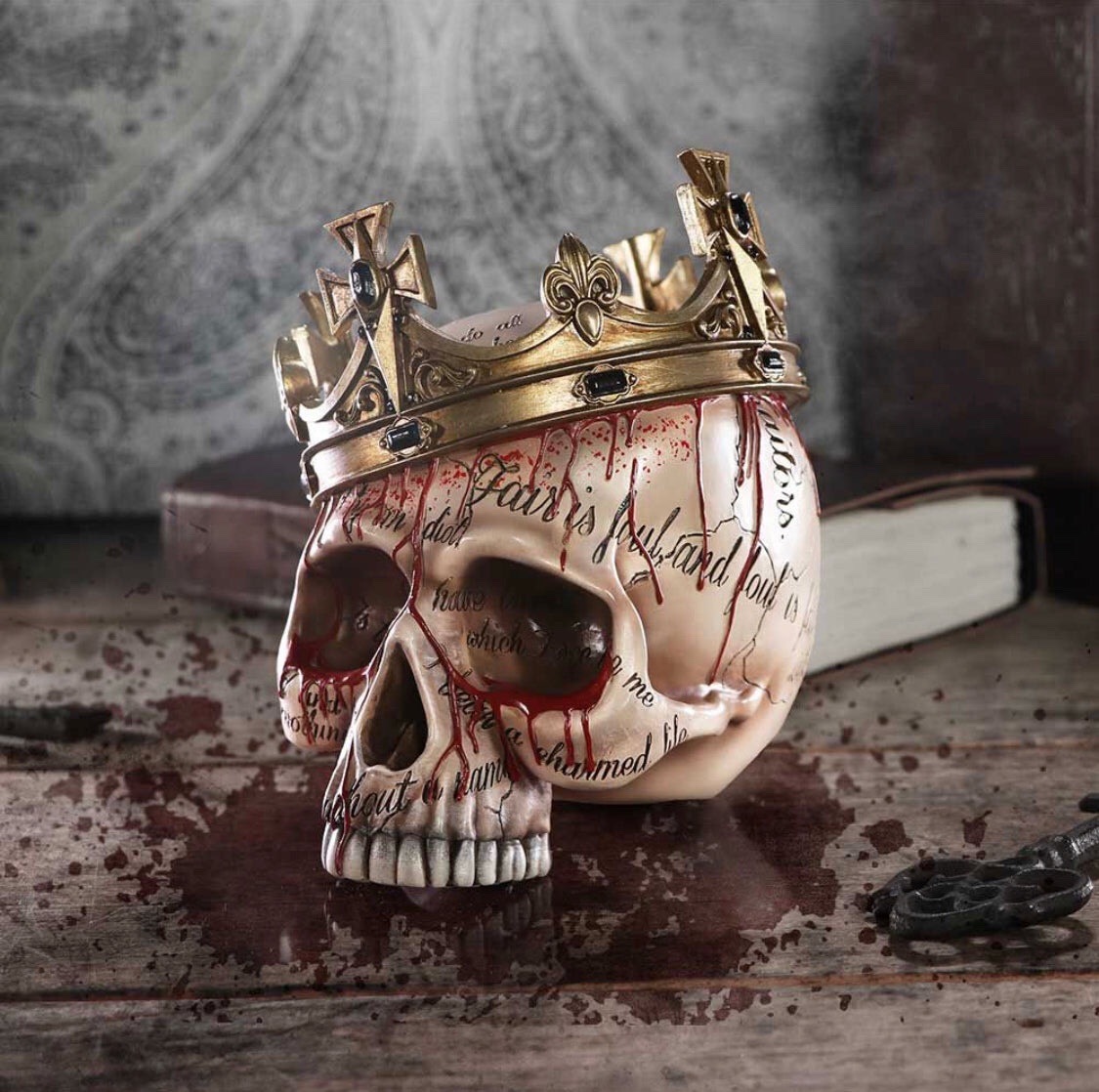 Nemesis Now© “Macbeth” Blood Scribe Writing Skull with Crown (15cm) (Bone/Gold)
